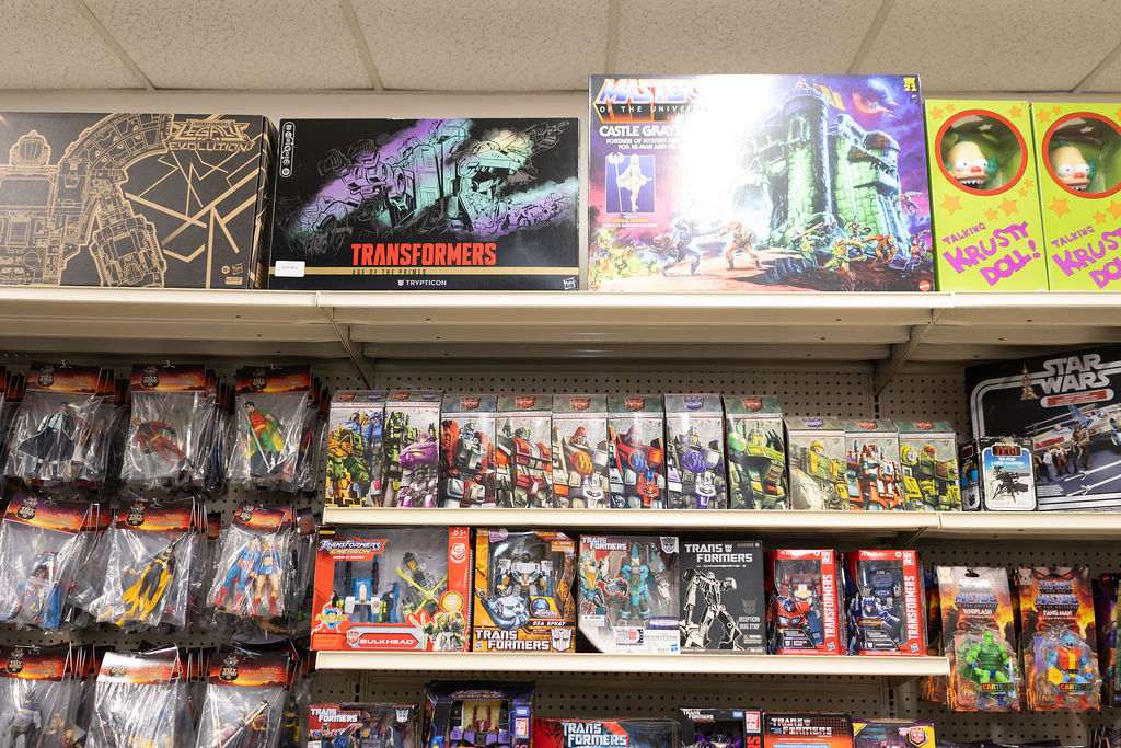 Vintage Masters of the Universe and Transformers on the shelf at The Toy Outpost.