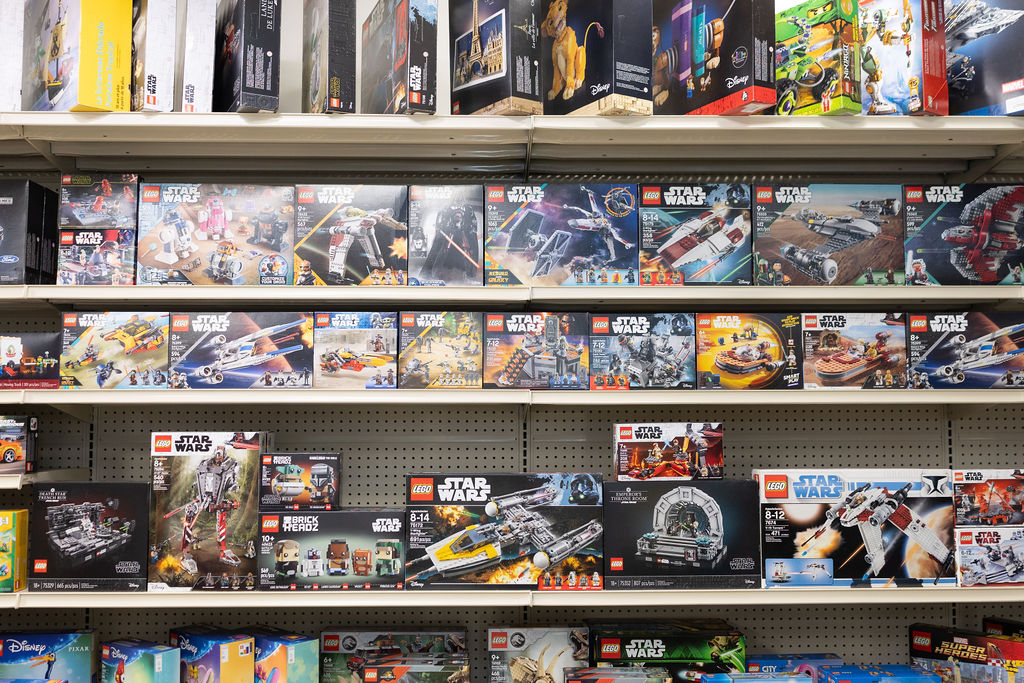 Shelves of LEGO sets at The Toy Outpost.