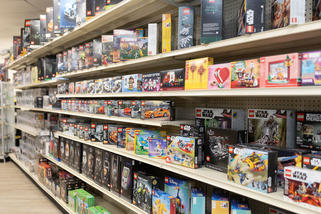 Floor-to-ceiling LEGO wall with Star Wars, Speed Champions, Technic, and more.